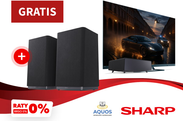 Dwa czarne głośniki oraz telewizor z wyświetlonym obrazem samochodu na ulicy nocą. Nad głośnikami znajduje się napis Gratis, a w dole grafiki loga Sharp i Aquos oraz napis: Raty 0% RRSO 0%.